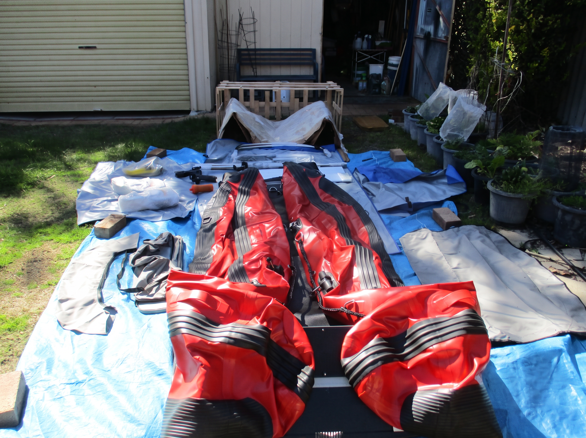Aerowave Viper 330 catamaran hull rolled out at home with bimini, bags and fittings ready for first assembly