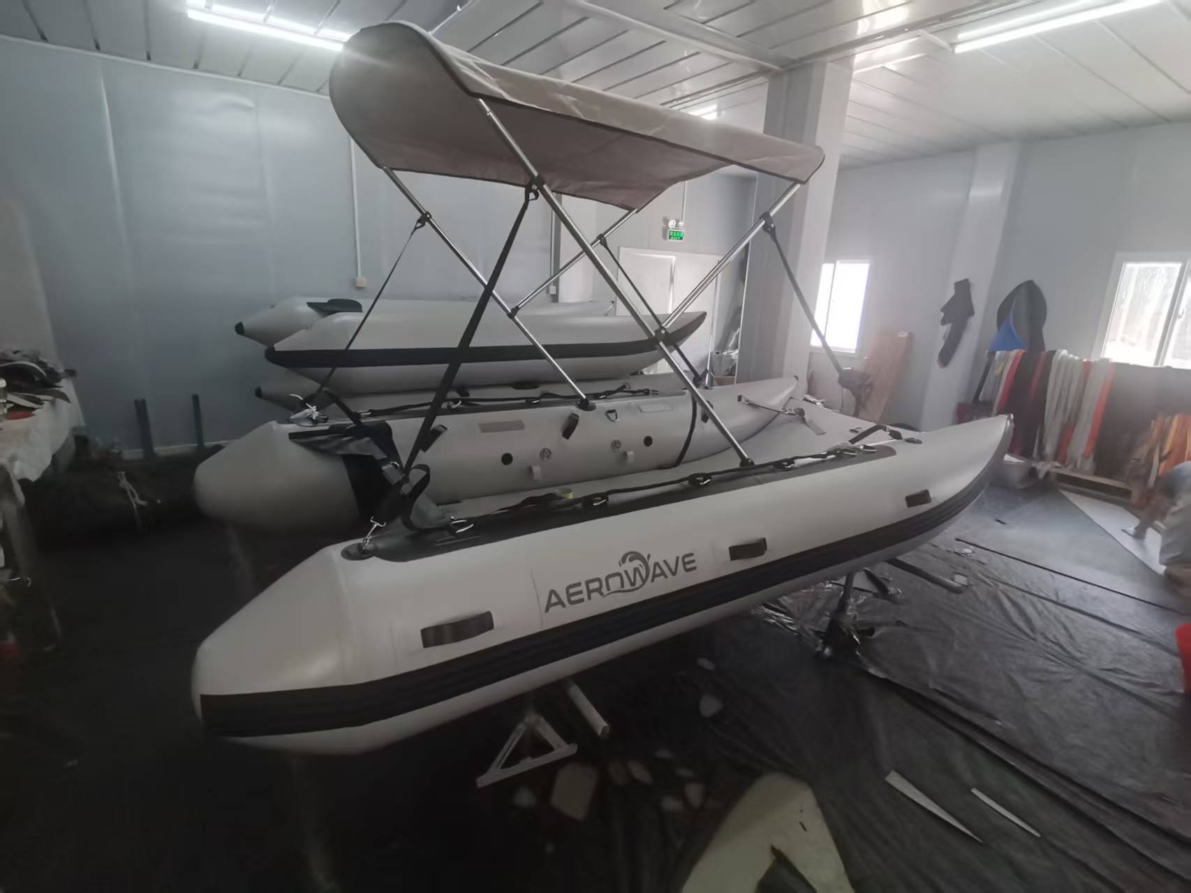 Aerowave Viper 330 inflatable boat fitted with a bimini sun top on calm Australian water