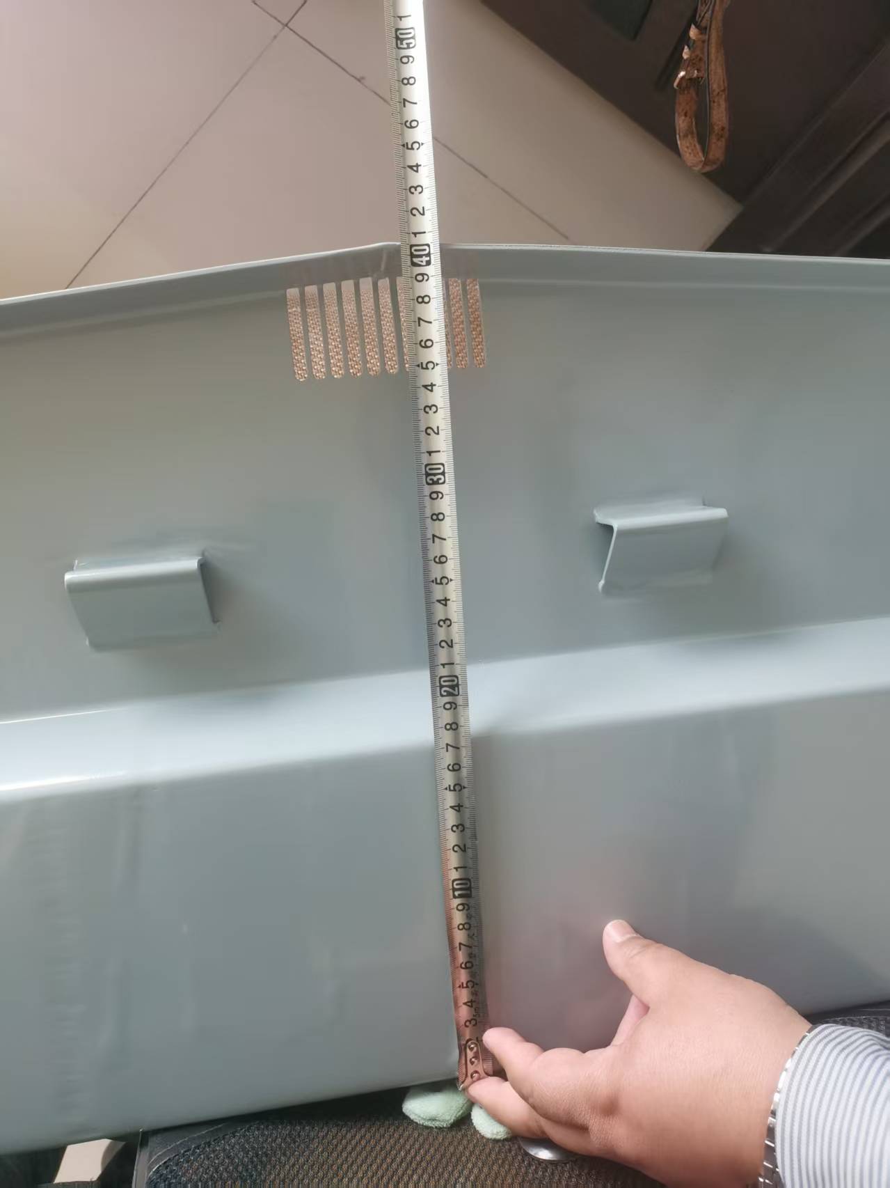 Aluminium transom drainage grill at the base of the transom — 405 mm transom height shown with tape measure