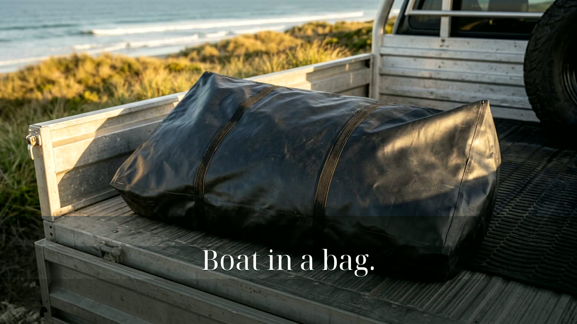 Aerowave boat packed in a carry bag on the back of a beachside ute