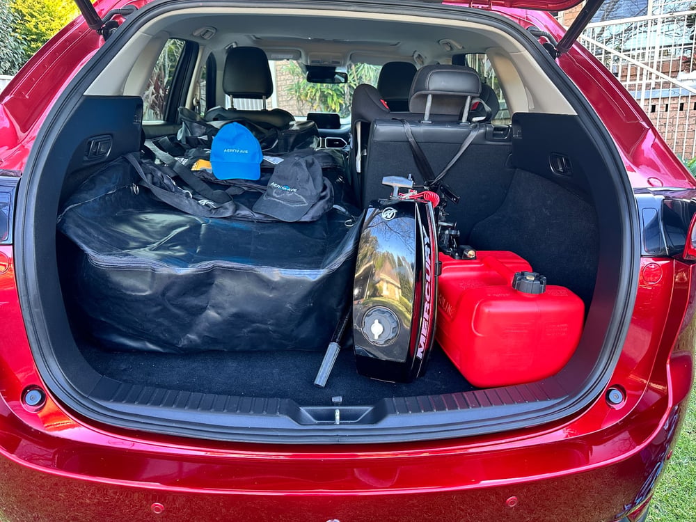 AeroCat 360 packed in its boat bag, loaded into the boot of a Mazda CX-5