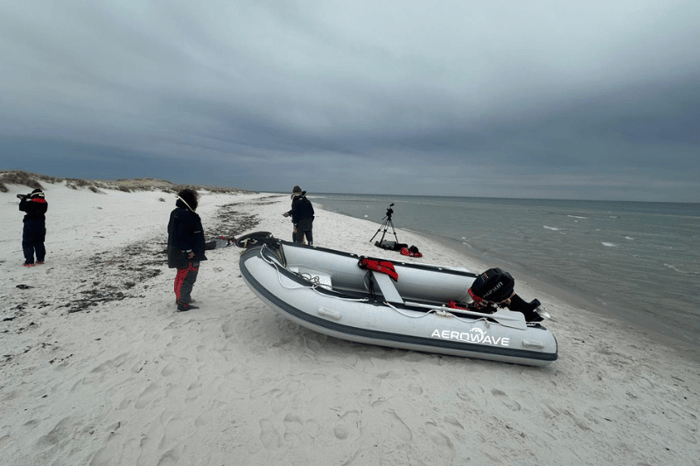Aerowave Sprint 350 monohull RIB on an Australian beach, stern view with outboard fitted