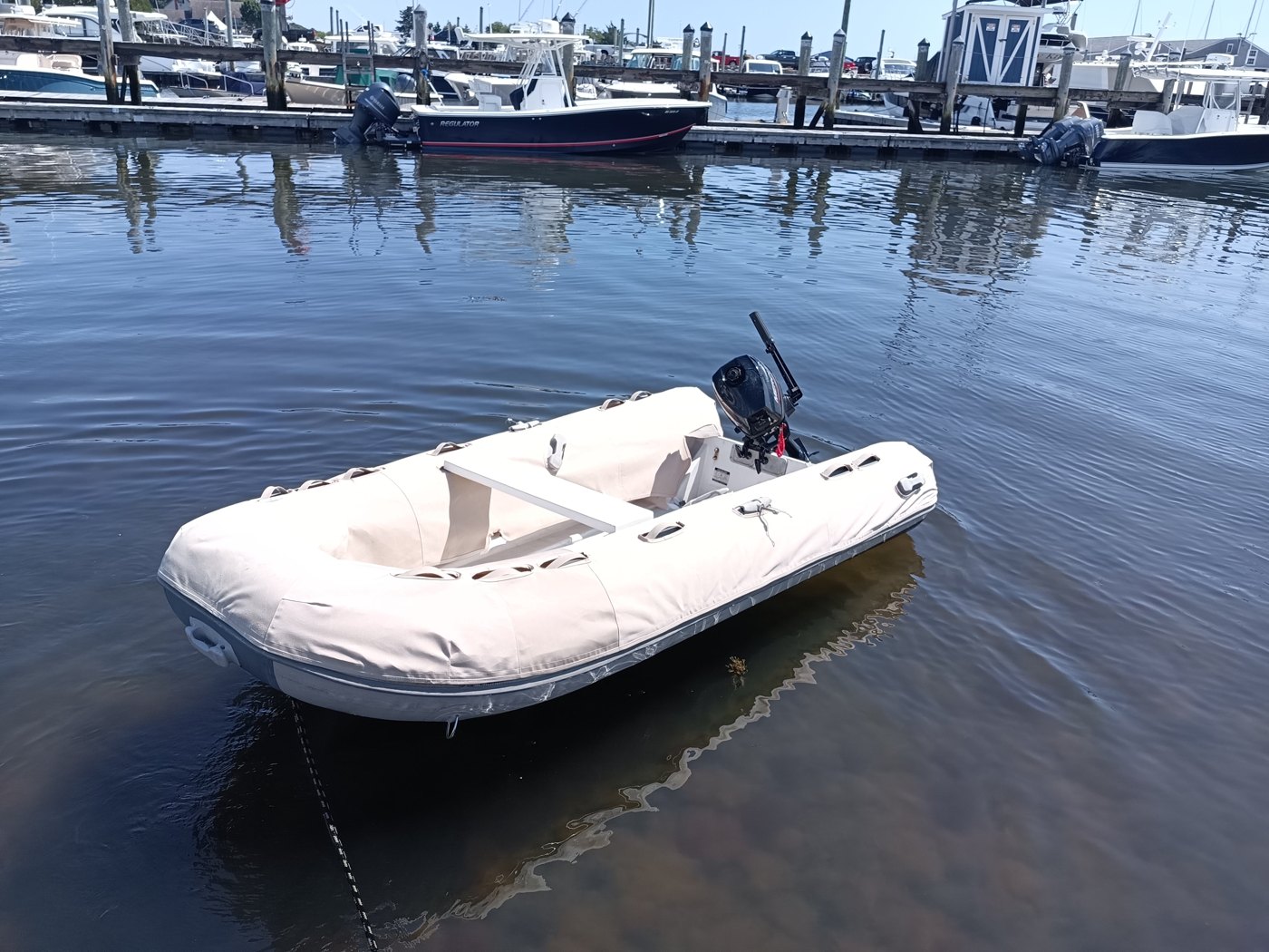 Light canvas tube chaps on an inflatable boat on the water