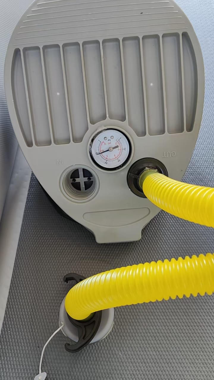 The photo shows the gauge near or above the recommended maximum—stop pumping by 10 PSI.