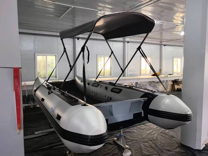 Aerowave Viper 365 inflatable catamaran on the water in Australia, showing the grey hull and black rubbing strake